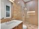 Modern bathroom featuring a glass shower and a stylish vanity with a sleek countertop at 211 Granite Ct, Boulder City, NV 89005