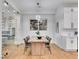 Modern dining room with a wooden table, seating for six, and a unique wine rack wall at 211 Granite Ct, Boulder City, NV 89005