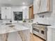 Updated kitchen featuring stainless steel range and marble countertops at 211 Granite Ct, Boulder City, NV 89005