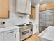 Modern kitchen with stainless steel appliances and custom cabinetry at 211 Granite Ct, Boulder City, NV 89005