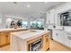 Open kitchen with dual islands, modern lighting, and stainless steel appliances at 211 Granite Ct, Boulder City, NV 89005