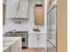 Updated kitchen featuring stainless steel range and marble countertops at 211 Granite Ct, Boulder City, NV 89005