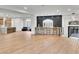 Expansive living area featuring sleek hardwood floors and a modern design aesthetic at 211 Granite Ct, Boulder City, NV 89005