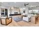 Bright living room featuring a modern fireplace, sleek furniture, and ample natural light at 211 Granite Ct, Boulder City, NV 89005