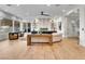 Spacious living room with a sleek fireplace, wood floors, and modern decor at 211 Granite Ct, Boulder City, NV 89005