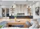 Bright living room featuring a modern fireplace, sleek furniture, and ample natural light at 211 Granite Ct, Boulder City, NV 89005