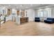 Spacious open-concept living area featuring a kitchen with an island, cozy seating, and lots of natural light at 211 Granite Ct, Boulder City, NV 89005