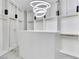 Spacious walk-in closet with custom shelving, ample storage, and modern lighting at 211 Granite Ct, Boulder City, NV 89005