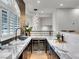 Elegant wet bar with wine fridge, marble countertops, and stylish design at 211 Granite Ct, Boulder City, NV 89005