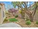 Beautiful backyard featuring desert landscaping, an artificial turf area, and a decorative fountain at 2429 Wisconsin Dells Dr, Henderson, NV 89044