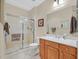 Modern bathroom featuring a walk-in shower, toilet, sink and neutral-toned walls and tiles at 2429 Wisconsin Dells Dr, Henderson, NV 89044