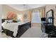 Cozy bedroom featuring neutral walls, plush carpet, a ceiling fan, and comfortable furnishings at 2429 Wisconsin Dells Dr, Henderson, NV 89044
