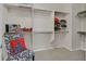 Organized walk-in closet with custom shelving and ample storage space for clothes and accessories at 2429 Wisconsin Dells Dr, Henderson, NV 89044