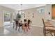 Dining room with a table set for four, chandelier lighting, and sliding glass doors to the backyard at 2429 Wisconsin Dells Dr, Henderson, NV 89044