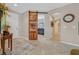Entryway with custom wood sliding door and neutral décor at 2429 Wisconsin Dells Dr, Henderson, NV 89044
