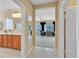 Inviting hallway with tile flooring leads to a spacious bathroom and living area, enhancing the home's flow at 2429 Wisconsin Dells Dr, Henderson, NV 89044