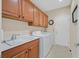 Well-equipped laundry room with a sink, cabinetry, and modern washer and dryer for added convenience at 2429 Wisconsin Dells Dr, Henderson, NV 89044
