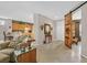 Spacious living room featuring tile floors, with open access to kitchen, dining and decorative barn door at 2429 Wisconsin Dells Dr, Henderson, NV 89044