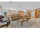 Open-concept living room and dining area with tile flooring, comfortable seating and natural light at 2429 Wisconsin Dells Dr, Henderson, NV 89044
