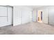Bedroom featuring neutral carpet with closet and access to the attached bathroom at 2482 Denholme St, Henderson, NV 89044