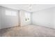Bedroom with gray carpet and shutters on the windows providing natural light at 2482 Denholme St, Henderson, NV 89044