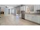 Bright kitchen and living area with stainless steel appliances and fireplace at 2482 Denholme St, Henderson, NV 89044