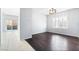 Bright living room with hardwood floors, a window, and sliding glass doors at 2482 Denholme St, Henderson, NV 89044