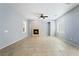 Spacious living room featuring a fireplace, tile floors, and neutral paint at 2482 Denholme St, Henderson, NV 89044