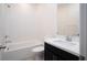 Bright bathroom features a shower/tub combo, white tile backsplash and vanity at 25 Barbara Ln # 57, Las Vegas, NV 89183
