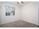 This bedroom features a ceiling fan and a bright window at 25 Barbara Ln # 57, Las Vegas, NV 89183