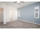 Bright bedroom features plush carpet, ceiling fan and lots of natural light from two windows at 25 Barbara Ln # 57, Las Vegas, NV 89183