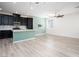 Bright kitchen and dining area with sleek black cabinets and an island at 25 Barbara Ln # 57, Las Vegas, NV 89183