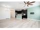Spacious living area with view of eat-in kitchen, with island, and modern appliances at 25 Barbara Ln # 57, Las Vegas, NV 89183