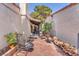Enclosed backyard patio area with brick ground cover and outdoor seating at 2583 Egret Cir, Las Vegas, NV 89121