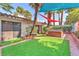 Cozy backyard features a hot tub, artificial grass, and shade sails for outdoor enjoyment at 2583 Egret Cir, Las Vegas, NV 89121