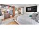 Well-lit bedroom with wood floor, closet, and ceiling fan at 2583 Egret Cir, Las Vegas, NV 89121