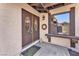 Inviting front entryway with double doors, exterior lighting, and a convenient window bench at 2583 Egret Cir, Las Vegas, NV 89121