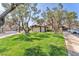 Charming exterior view of a home featuring lush green lawn and mature shade trees, creating a serene and inviting atmosphere at 2583 Egret Cir, Las Vegas, NV 89121