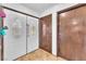 Bright foyer with elegant double doors, parquet flooring, and a convenient closet at 2583 Egret Cir, Las Vegas, NV 89121