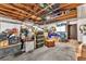 Spacious garage with exposed ceiling beams, packed with storage, and a laundry area, perfect for organization and functionality at 2583 Egret Cir, Las Vegas, NV 89121
