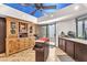 Kitchen with an island, natural wood cabinets, stainless steel appliances, and a view to the patio at 2583 Egret Cir, Las Vegas, NV 89121