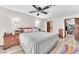 Serene main bedroom with a ceiling fan, en-suite bathroom, and walk-in closet at 2583 Egret Cir, Las Vegas, NV 89121
