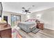 Calm main bedroom with a ceiling fan, a sliding glass door, and neutral color scheme at 2583 Egret Cir, Las Vegas, NV 89121