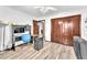 Office area with wood look flooring, desk, rolling chair, and storage at 2583 Egret Cir, Las Vegas, NV 89121