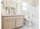 Bathroom featuring a vanity with a mirror, lighting, a toilet, and a shower/bathtub combo at 2605 Memphis Ave, Henderson, NV 89052