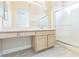 Bathroom featuring double sinks, vanity, and tiled shower at 2605 Memphis Ave, Henderson, NV 89052