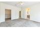 Bright bedroom with carpet flooring, closet, and adjoining bathroom at 2605 Memphis Ave, Henderson, NV 89052