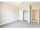 Bedroom with neutral carpet, closet, and doorway to an adjacent room at 2605 Memphis Ave, Henderson, NV 89052