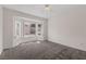 Bedroom with a large window, neutral carpet, and ceiling fan at 2605 Memphis Ave, Henderson, NV 89052