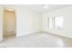 Bright and airy bedroom with tile flooring and a large window at 2605 Memphis Ave, Henderson, NV 89052